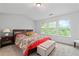 Well-lit bedroom featuring plush carpeting and three windows offering serene views at 2826 Snapfinger Mnr, Decatur, GA 30035