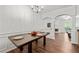 Dining room with hardwood flooring and seamless access to the living room at 2826 Snapfinger Mnr, Decatur, GA 30035