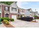 Townhome with brick facade, attached garages, and manicured landscaping, providing great curb appeal at 2826 Snapfinger Mnr, Decatur, GA 30035