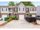 Attractive brick and siding townhome with a driveway and well-maintained landscaping at 2826 Snapfinger Mnr, Decatur, GA 30035