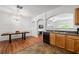 Bright kitchen with granite countertops, stainless sink, modern fixtures and archways at 2826 Snapfinger Mnr, Decatur, GA 30035
