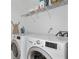 Convenient laundry room with washer, dryer, and overhead shelving at 2826 Snapfinger Mnr, Decatur, GA 30035