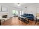 Inviting living room features a fireplace, hardwood floors, and lots of natural light at 2826 Snapfinger Mnr, Decatur, GA 30035