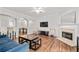 Spacious living room with archways, a fireplace, and seamless flow to the dining area at 2826 Snapfinger Mnr, Decatur, GA 30035