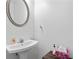 Simple powder room with pedestal sink and decorative mirror at 2826 Snapfinger Mnr, Decatur, GA 30035