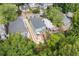 Aerial view of a charming two-story home featuring a back porch and a long modern driveway at 425 Harold Ne Ave, Atlanta, GA 30307