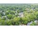 Scenic aerial view showcases homes nestled among mature trees in a vibrant neighborhood at 425 Harold Ne Ave, Atlanta, GA 30307