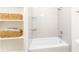 Clean bathroom with white subway tile surround and shelving at 425 Harold Ne Ave, Atlanta, GA 30307
