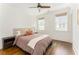 Bedroom featuring hardwood floors, soft natural light, and neutral decor at 425 Harold Ne Ave, Atlanta, GA 30307