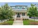 Charming two-story home featuring a brick facade, inviting front porch, and manicured lawn at 425 Harold Ne Ave, Atlanta, GA 30307