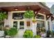 Charming flower shop exterior with hanging ferns and fresh cut flowers sign on a brick building at 425 Harold Ne Ave, Atlanta, GA 30307