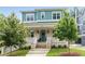 Charming two-story home featuring a brick facade, inviting front porch, and manicured lawn at 425 Harold Ne Ave, Atlanta, GA 30307