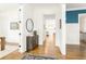 Bright foyer with hardwood floors, stylish console table, and views of the living spaces at 425 Harold Ne Ave, Atlanta, GA 30307