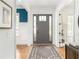 Elegant foyer features hardwood floors, wainscoting, stylish lighting, and a modern front door at 425 Harold Ne Ave, Atlanta, GA 30307