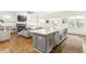 Open concept kitchen with large island, stainless appliances, hardwood floors, and seamless access to the living room at 425 Harold Ne Ave, Atlanta, GA 30307