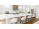 Spacious kitchen island with white marble countertop, seating, and modern fixtures at 425 Harold Ne Ave, Atlanta, GA 30307
