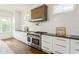 Spacious kitchen with stainless steel range, modern vent hood, and sleek countertops at 425 Harold Ne Ave, Atlanta, GA 30307