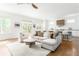 Bright and open living room featuring a neutral color palette, hardwood floors, and seamless access to the kitchen at 425 Harold Ne Ave, Atlanta, GA 30307