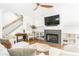 Light and airy living room features a fireplace, built-in shelves, and staircase with iron balusters at 425 Harold Ne Ave, Atlanta, GA 30307