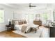 Spacious primary bedroom featuring a tray ceiling, windows, and hardwood floors at 425 Harold Ne Ave, Atlanta, GA 30307