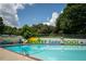 Community pool with clear blue water, lifeguard stand, and painted mural at 425 Harold Ne Ave, Atlanta, GA 30307