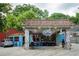 Exterior view of a colorful La Fonda Latina restaurant, with outdoor seating and vibrant decor at 425 Harold Ne Ave, Atlanta, GA 30307