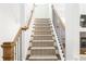 Staircase with wood treads, white risers, and black iron railing at 425 Harold Ne Ave, Atlanta, GA 30307