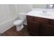 A bathroom featuring a modern vanity with a sleek white countertop and dark wood cabinetry at 6069 Semaphore Rdg, Rex, GA 30273