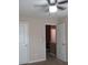 Bedroom with a ceiling fan and doors leading to other parts of the house at 6069 Semaphore Rdg, Rex, GA 30273
