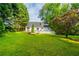 Expansive backyard featuring a lush lawn and a charming deck, perfect for outdoor gatherings at 1007 Natalie Se Ln, Smyrna, GA 30082