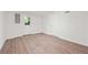 Finished basement with wood-look flooring, a door to the backyard, and a utility door at 1007 Natalie Se Ln, Smyrna, GA 30082