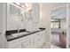 Bathroom boasts double sinks with black granite countertops and a marble tiled walk-in shower at 1007 Natalie Se Ln, Smyrna, GA 30082