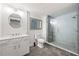 Modern bathroom featuring glass shower, beautiful vanity, stylish floor tiles, and contemporary finishes at 1007 Natalie Se Ln, Smyrna, GA 30082