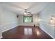 Spacious bedroom features hardwood floors, wainscoting, a ceiling fan, and a window view at 1007 Natalie Se Ln, Smyrna, GA 30082