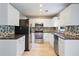 Modern kitchen featuring stainless steel appliances, white cabinets, and stylish backsplash at 1007 Natalie Se Ln, Smyrna, GA 30082