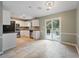 Eat-in kitchen with stainless steel appliances, white cabinets, and a sliding door to the patio at 1007 Natalie Se Ln, Smyrna, GA 30082