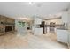 Open-concept living space with a fireplace, kitchen, and access to the front entrance at 1007 Natalie Se Ln, Smyrna, GA 30082