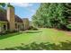 Large grassy backyard with mature trees at 1593 Fredricksberg Dr, Loganville, GA 30052