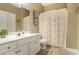 Cozy bathroom with tile flooring and a decorative shower curtain at 1593 Fredricksberg Dr, Loganville, GA 30052