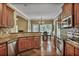 Bright kitchen featuring stainless steel appliances, granite countertops, and backyard view at 1593 Fredricksberg Dr, Loganville, GA 30052