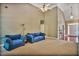 Spacious living room featuring vaulted ceiling, plush seating, and a hardwood foyer at 1593 Fredricksberg Dr, Loganville, GA 30052