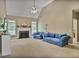 Bright living room with a fireplace, vaulted ceiling, and large windows providing natural light at 1593 Fredricksberg Dr, Loganville, GA 30052