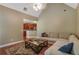 Comfortable living room with vaulted ceilings, hardwood floors, and a view into the kitchen at 1593 Fredricksberg Dr, Loganville, GA 30052