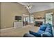 Inviting living room with fireplace and mantel, vaulted ceilings, and views of the dining area at 1593 Fredricksberg Dr, Loganville, GA 30052