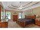 Spacious main bedroom with trey ceilings, fan, and neutral decor at 1593 Fredricksberg Dr, Loganville, GA 30052