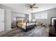 Comfortable bedroom with hardwood flooring and ceiling fan at 2103 Blue Creek Ct, Conley, GA 30288