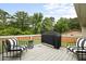 Outdoor deck featuring patio furniture and grill perfect for entertaining guests and relaxing at 2103 Blue Creek Ct, Conley, GA 30288
