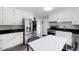 Eat-in kitchen features granite counters, stainless appliances, and hardwood-style flooring at 2103 Blue Creek Ct, Conley, GA 30288
