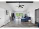 Bright living room with vaulted ceilings, wood floors, and access to the outdoor deck at 2103 Blue Creek Ct, Conley, GA 30288