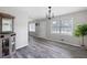 Open concept living room with hardwood floors and natural light from large windows at 2103 Blue Creek Ct, Conley, GA 30288